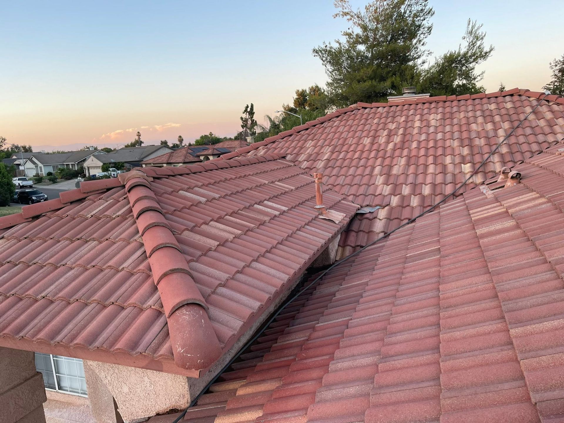 Restored tile roof at sunset